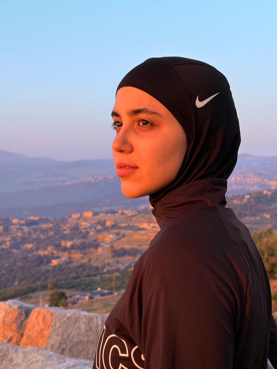 Aya Nouh portrait at sunset over Lebanon mountains